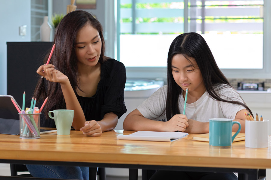 student and tutor together at a desk in San Antonio